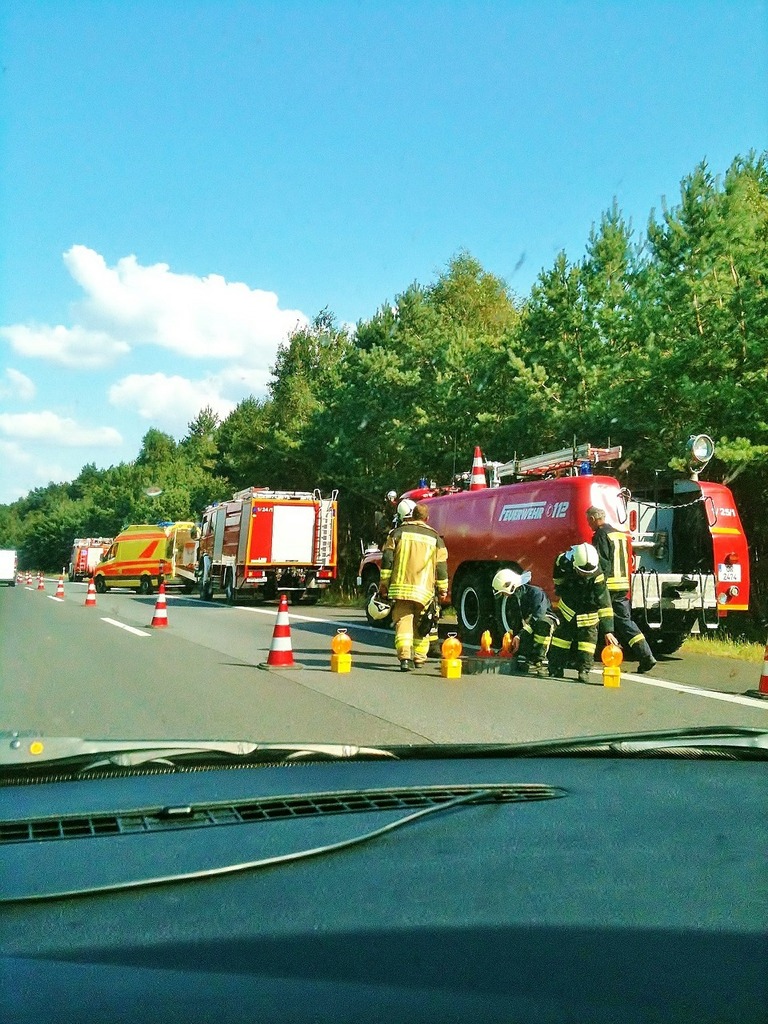 A bunch of fire trucks that are on the road. Accident a11 motorway