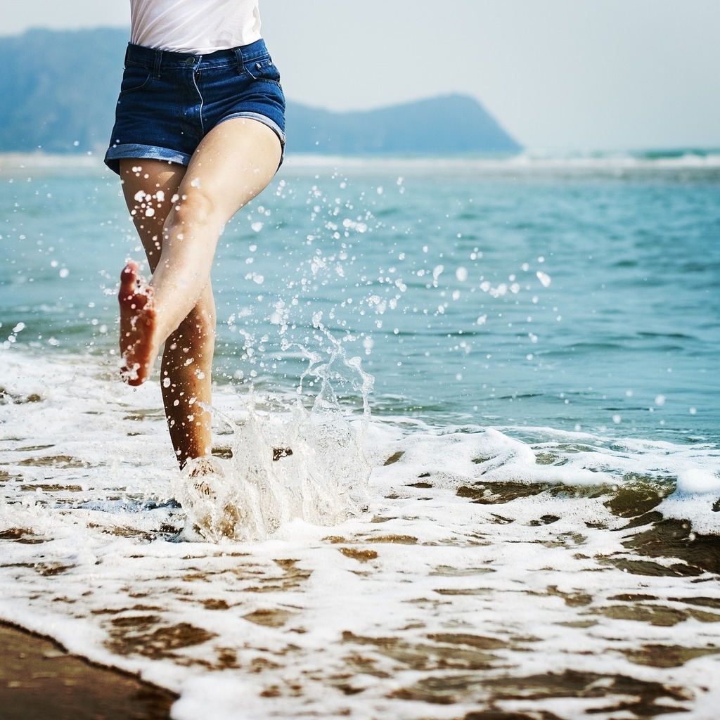 A woman is running in the water on the beach. Bare beach break - PICRYL -  Public Domain Media Search Engine Public Domain Search