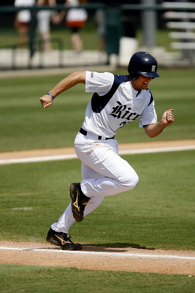 Playing behind the runner at first base 