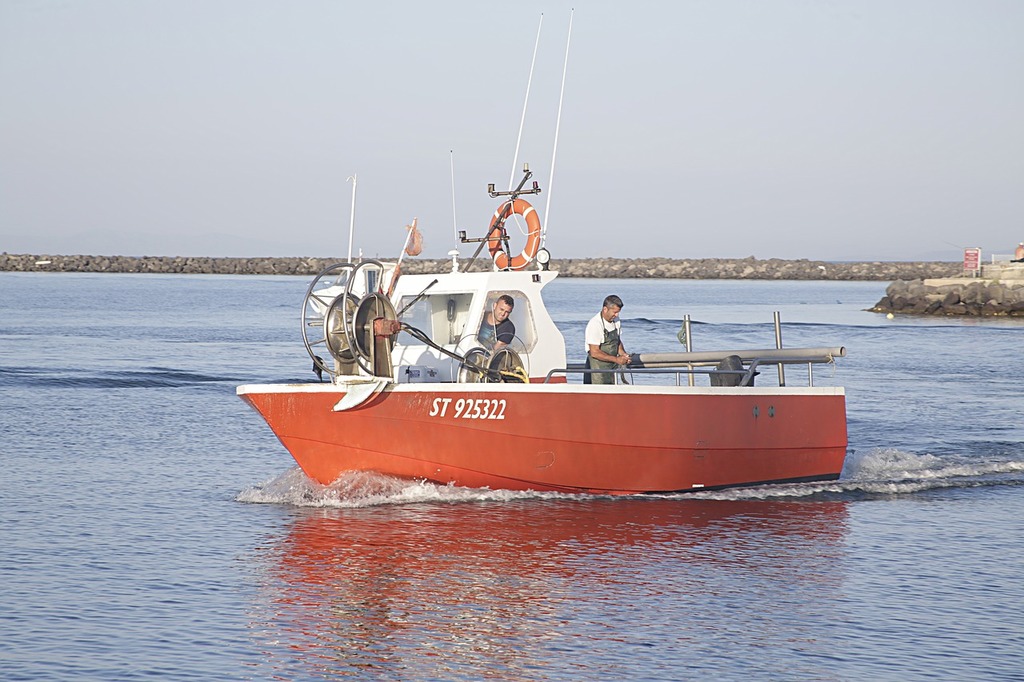 A boat filled with lots of buoys sitting on top of a body of water. Fishing boat  net fishing. - PICRYL - Public Domain Media Search Engine Public Domain  Search