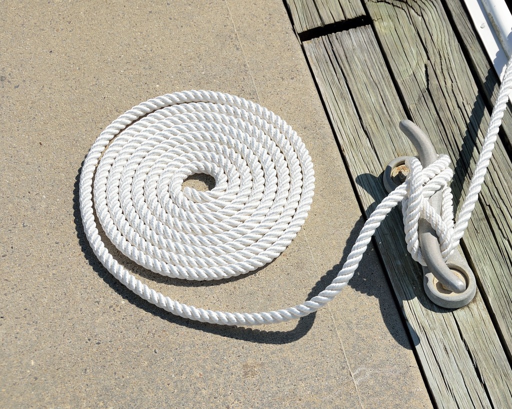 A close up of a rope on a boat. Rope cleat dock. - PICRYL - Public