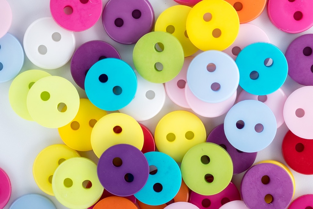 A pile of colorful buttons on a white surface. Buttons colored buttons  colored scattering. - PICRYL - Public Domain Media Search Engine Public  Domain Search