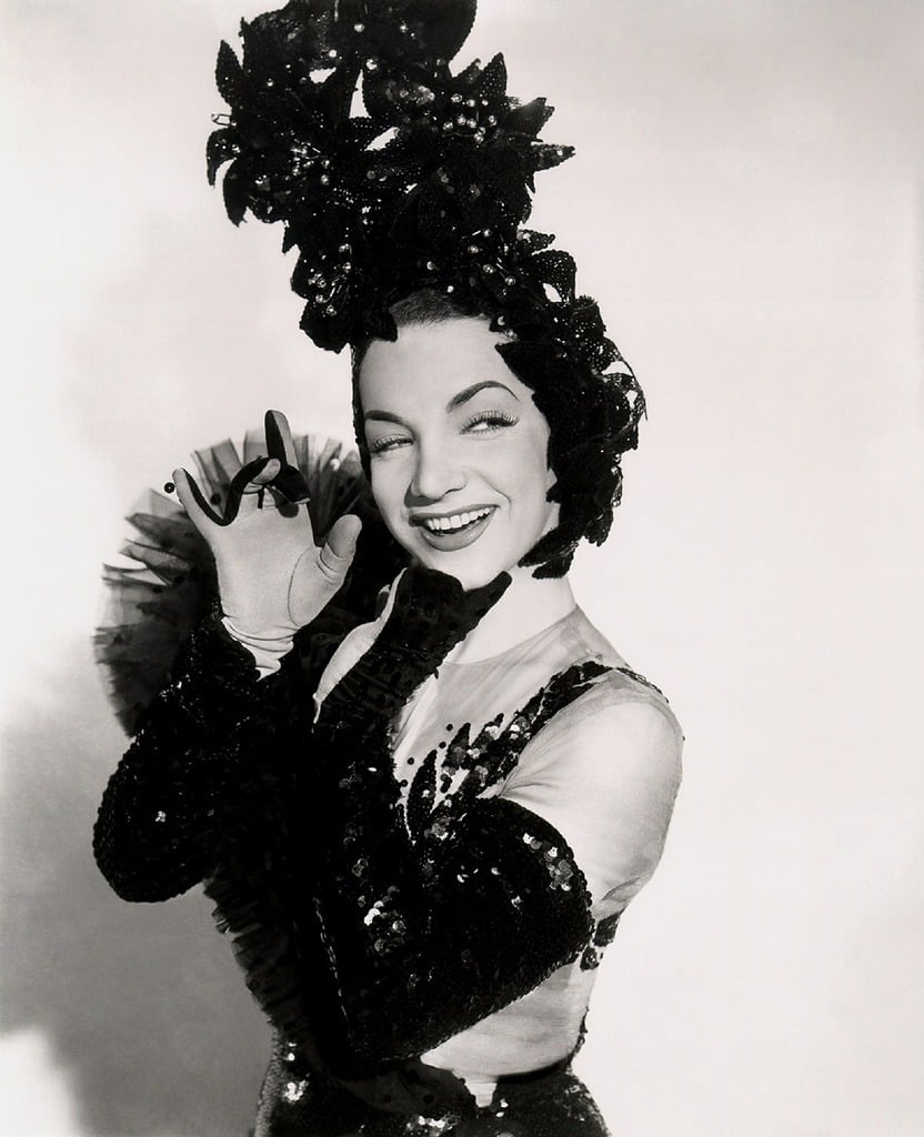 A black and white photo of a woman in a dress. Carmen miranda actress ...