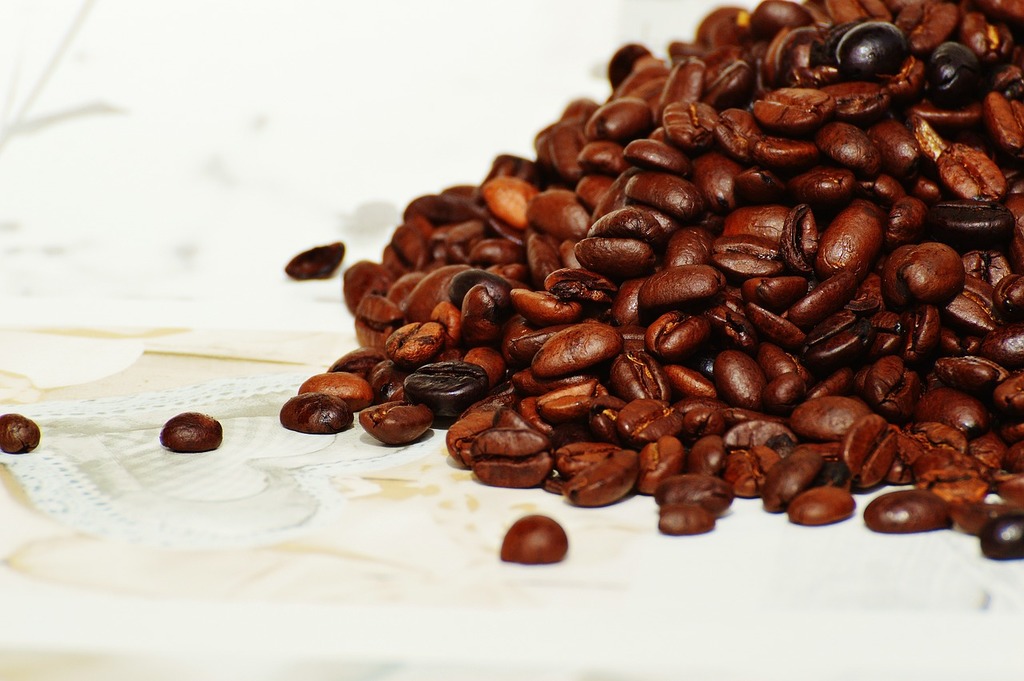 A silver coffee pot sitting on top of a pile of coffee beans. Coffee tea old  coffee maker, food drink. - PICRYL - Public Domain Media Search Engine  Public Domain Search