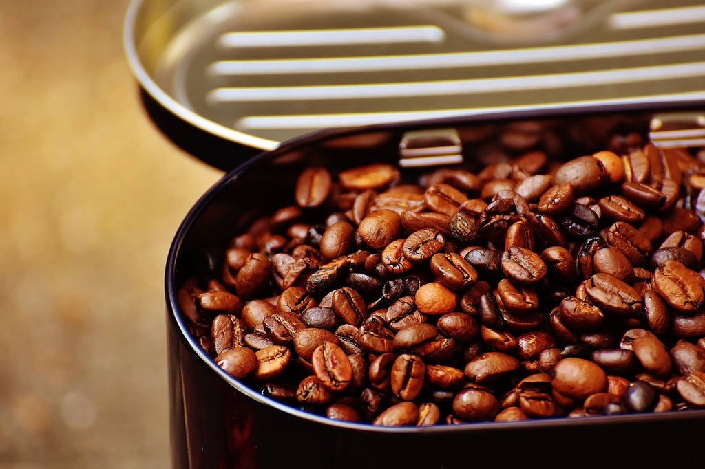 A silver coffee pot sitting on top of a pile of coffee beans. Coffee tea old  coffee maker, food drink. - PICRYL - Public Domain Media Search Engine  Public Domain Search