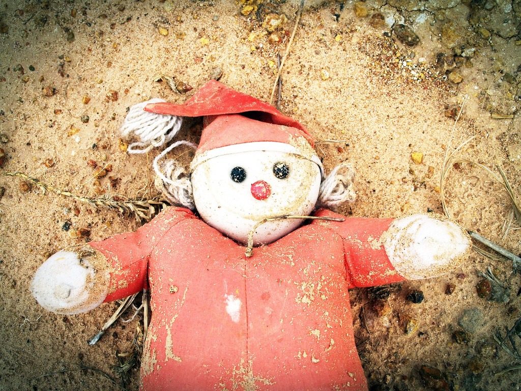 A stuffed snowman laying on the ground. Doll old weird, emotions. - PICRYL  - Public Domain Media Search Engine Public Domain Search