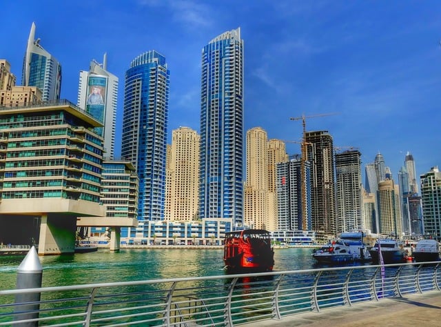 Dubai skyline skyscraper building. A view of a city from the water's ...