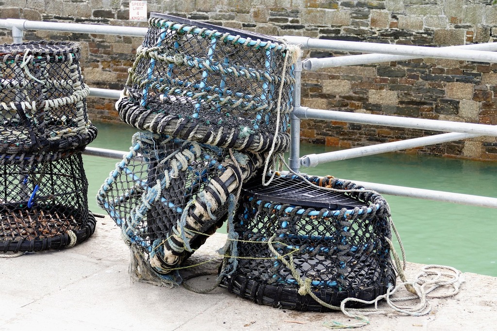 A couple of baskets sitting on top of a pier. Fishing nets crabs. - PICRYL  - Public Domain Media Search Engine Public Domain Search