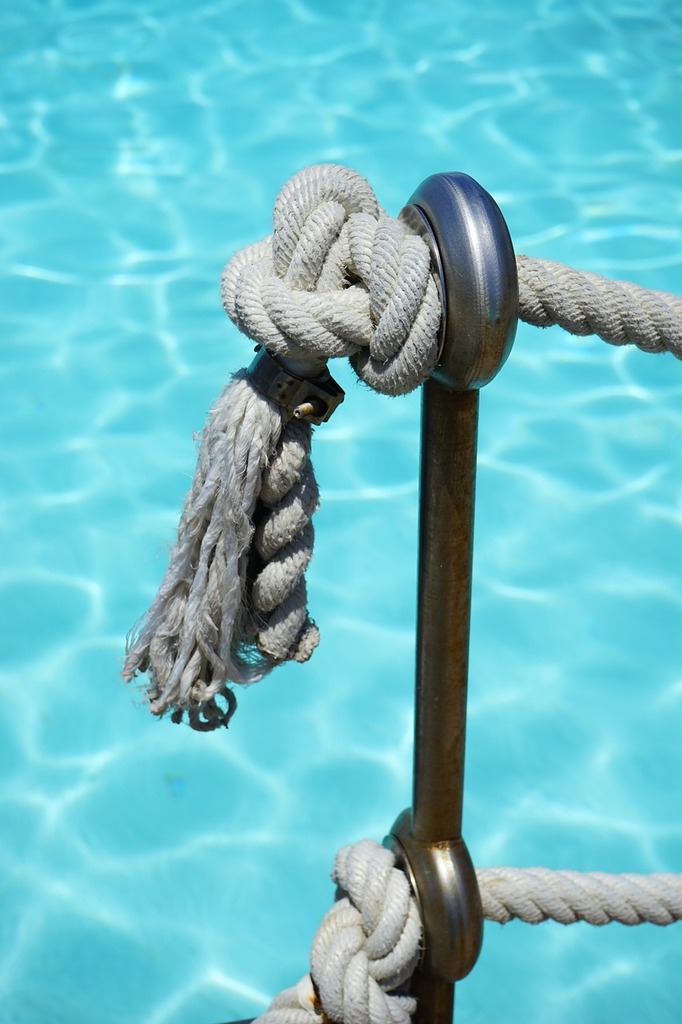 A close up of a rope on a boat. Rope cleat dock. - PICRYL - Public