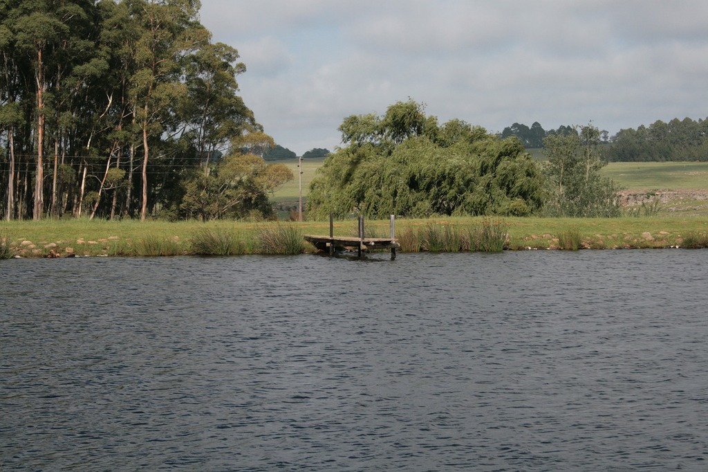 Young girl and two men fishing from boat - PICRYL - Public Domain