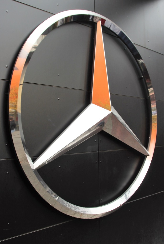 A mercedes logo on the side of a building. Mercedes star brand emblem,  business finance. - PICRYL - Public Domain Media Search Engine Public  Domain Search