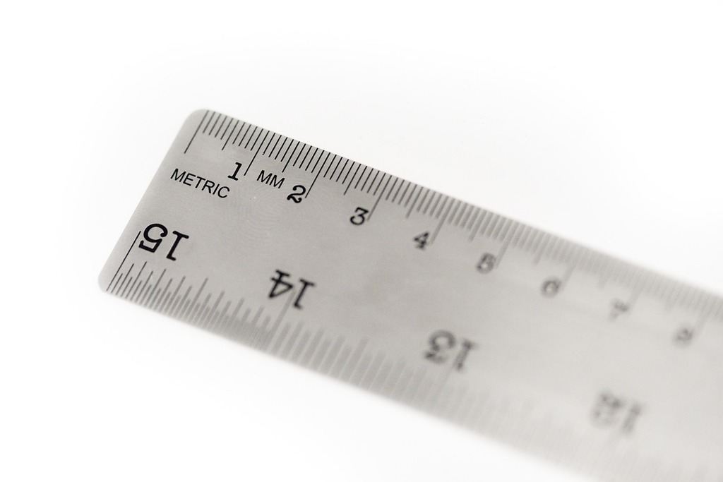 A close up of a ruler on a white surface. Millimeters metric measure. -  PICRYL - Public Domain Media Search Engine Public Domain Search
