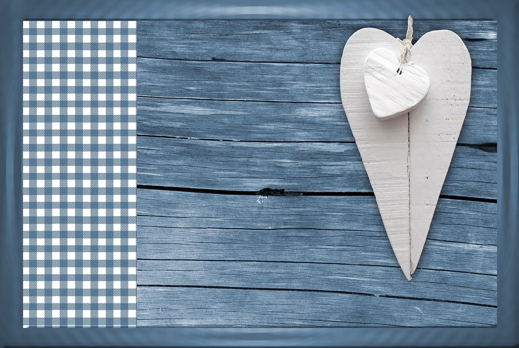 Patterns And Designs Of Green Wooden Heart On Blue Background With