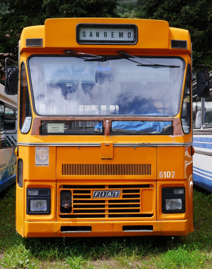 A yellow bus parked next to other buses. Old bus service bus fiat ...