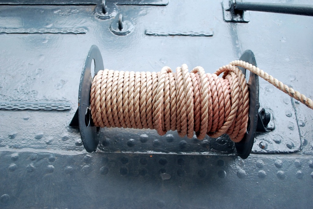 A spool of rope is attached to a boat. Rope reel ship. - PICRYL