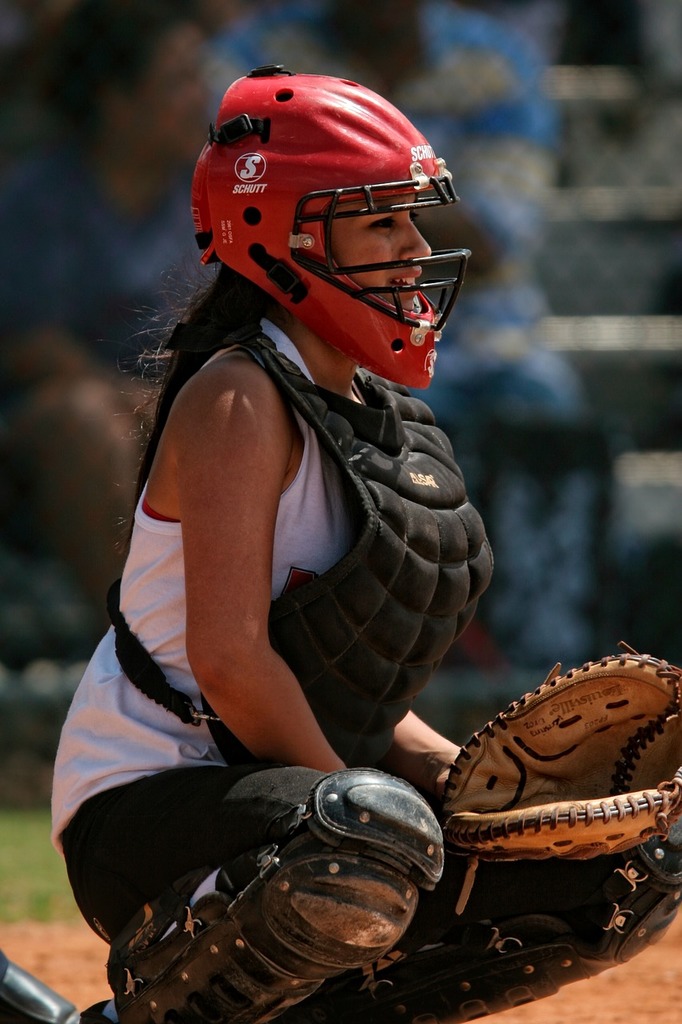 Download A Baseball Player Wearing A Gold Catchers Mask Wallpaper