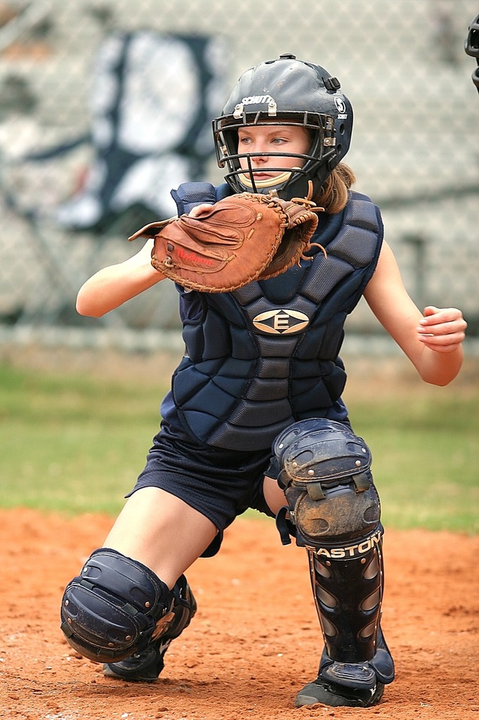 Download A Baseball Player Wearing A Gold Catchers Mask Wallpaper