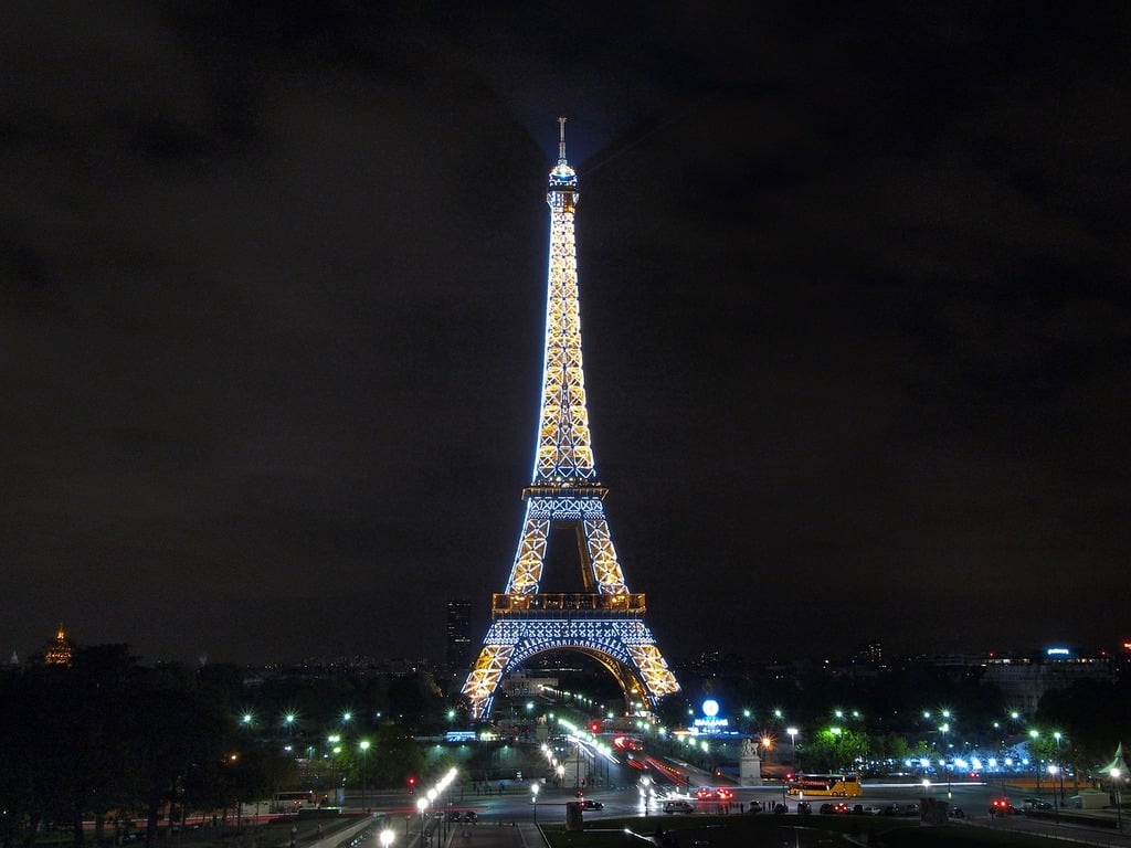 The eiffel tower is lit up at night. The eiffel tower france paris. -  PICRYL - Public Domain Media Search Engine Public Domain Image