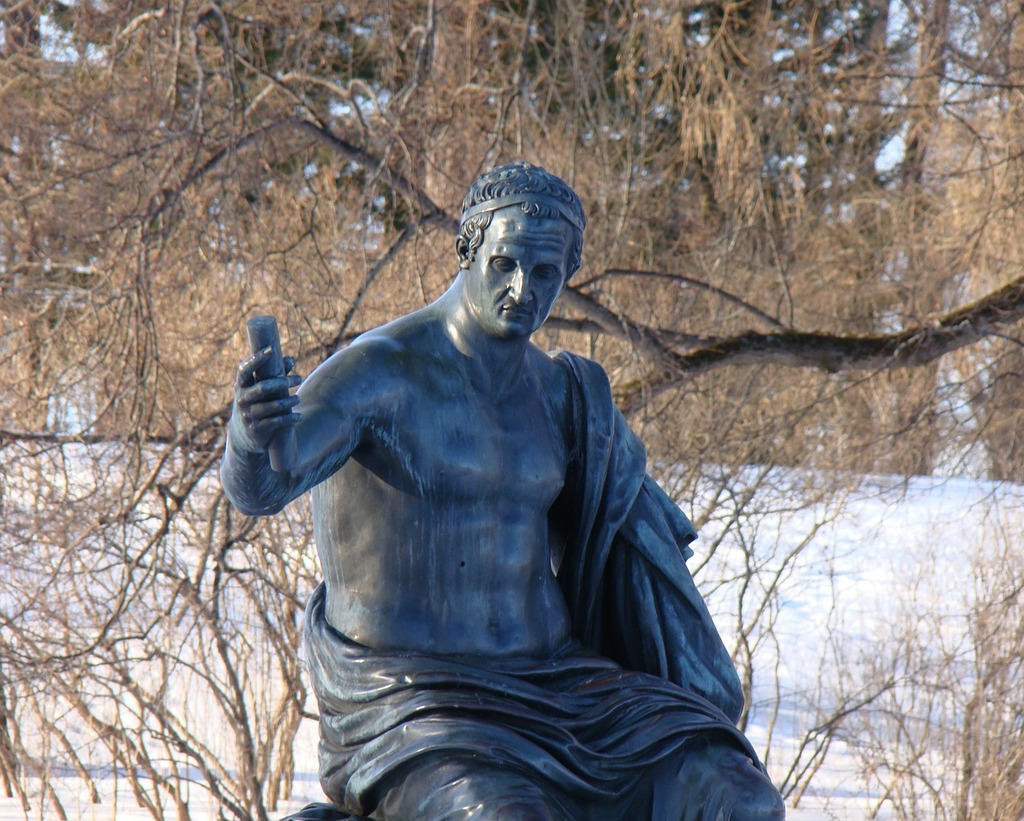 A statue of a man sitting on top of a snow covered ground. The palace  ensemble tsarskoe selo russia statue. - PICRYL - Public Domain Media Search  Engine Public Domain Image