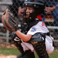 CAMP FOSTER, Okinawa, Japan – A child practices batting at a youth baseball  clinic July 29 aboard Camp Foster, Okinawa, Japan. The baseball clinic  hosted four different stations: hitting, running, catching and