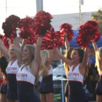 Los Angeles Rams cheerleaders pose with a child during - PICRYL