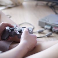 Teenager playing video games at home - Stock Photo - Masterfile - Premium  Royalty-Free, Code: 614-07768268