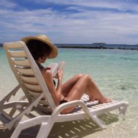 A person reading a book on the beach. Read reading open book. - PICRYL -  Public Domain Media Search Engine Public Domain Image